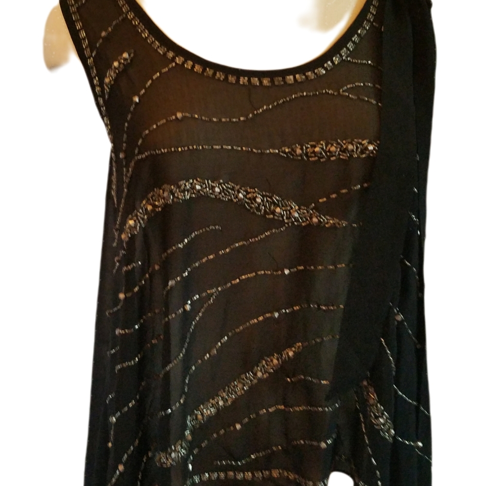 Sparkly Black Sleeveless Overlay with ribbon tie feature on shoulder. Small.